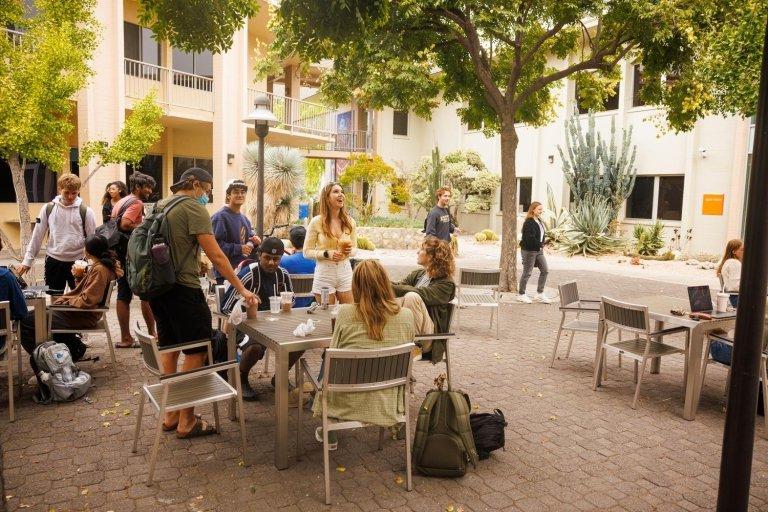 Students talk and work in Pitzer's Academic Courtyard